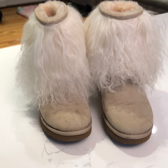 Monglian lamb Uggs in sand